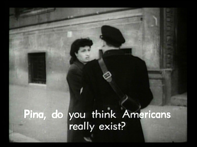 Subtitled still from Rome Open City: a woman speaks to a uniformed man in the street — 'Pina, do you think Americans really exist?' Subtitled still from Rome Open City: a woman speaks to a uniformed man in the street — 'Pina, do you think Americans really exist?'