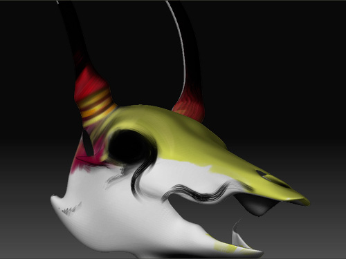 ZBrush sculpt of a stylized animal skull mask, yellow-green over white with red striped horns and black flame markings