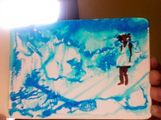 Hand holding a sketchbook: blue ink wash landscape of icy light with a small dark girl in a white dress standing at right
