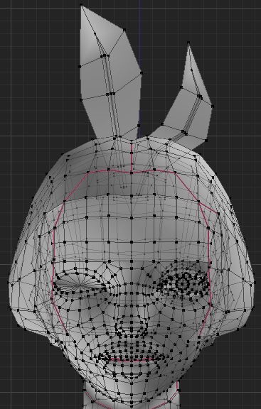 Grey Blender wireframe of a bunny-eared girl's head, dense mesh face with two flat ears sticking up