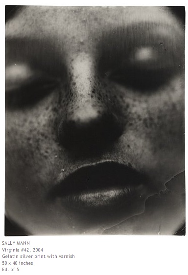 Sally Mann's Virginia #42 (2004): huge varnished silver print of a freckled sleeping face, eyes closed, gallery caption below