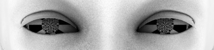 Strip of a 3d face: two almond eyes with snowflake-patterned kaleidoscope irises in pale skin