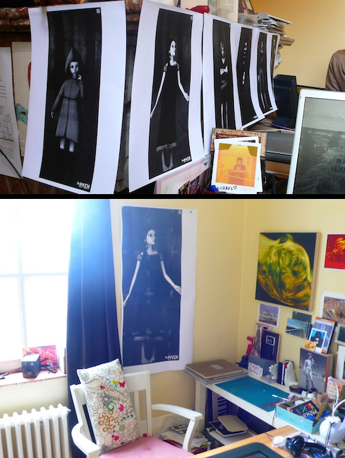 Path production prints: black-and-white posters of the six sisters hung on a line, and the tall Scarlet poster taped up over the tidy desk