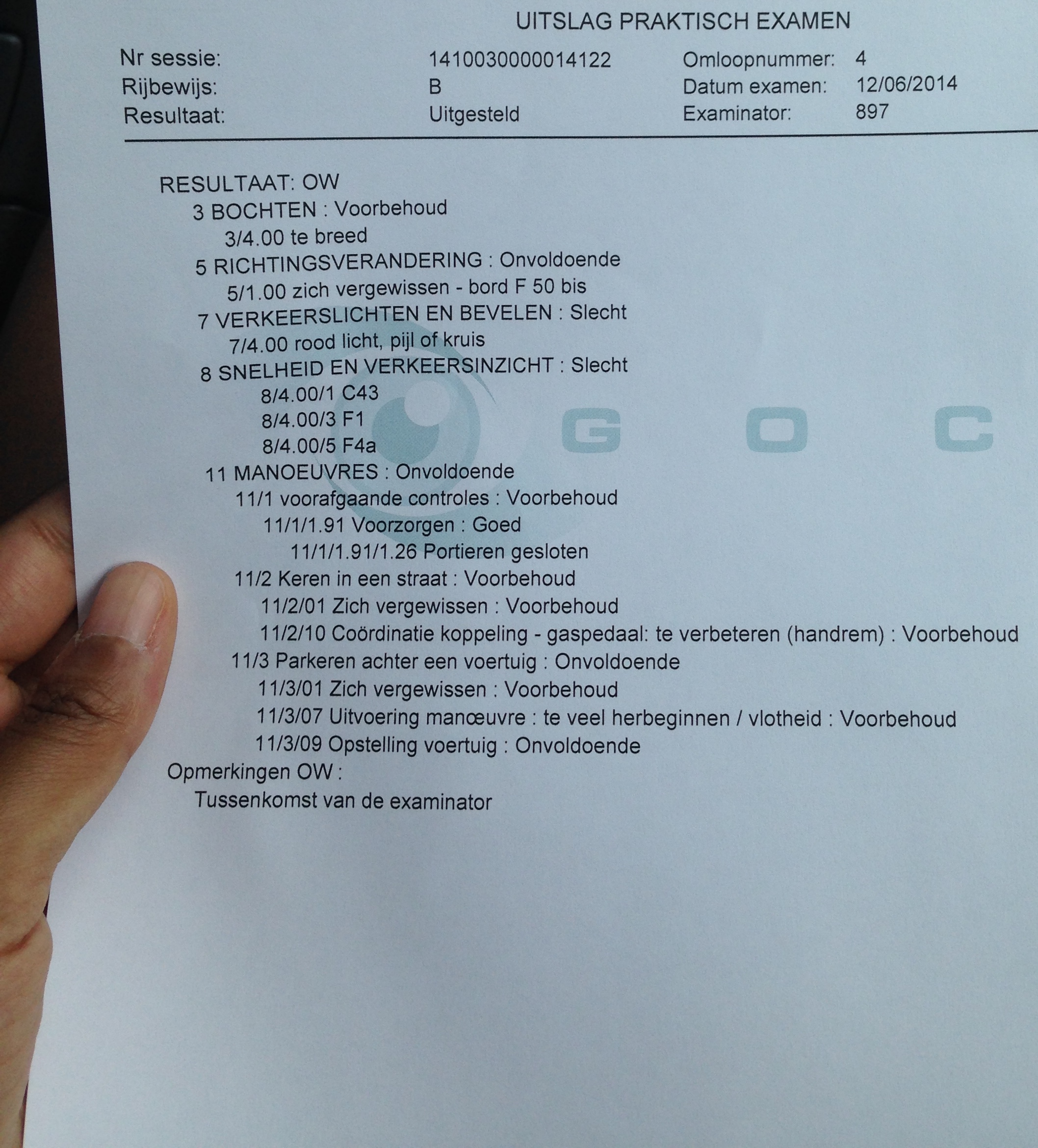 Belgian practical driving-exam sheet, 12/06/2014: 'Uitgesteld' — deferred — with the examiner's litany of Voorbehoud and Onvoldoende line by line