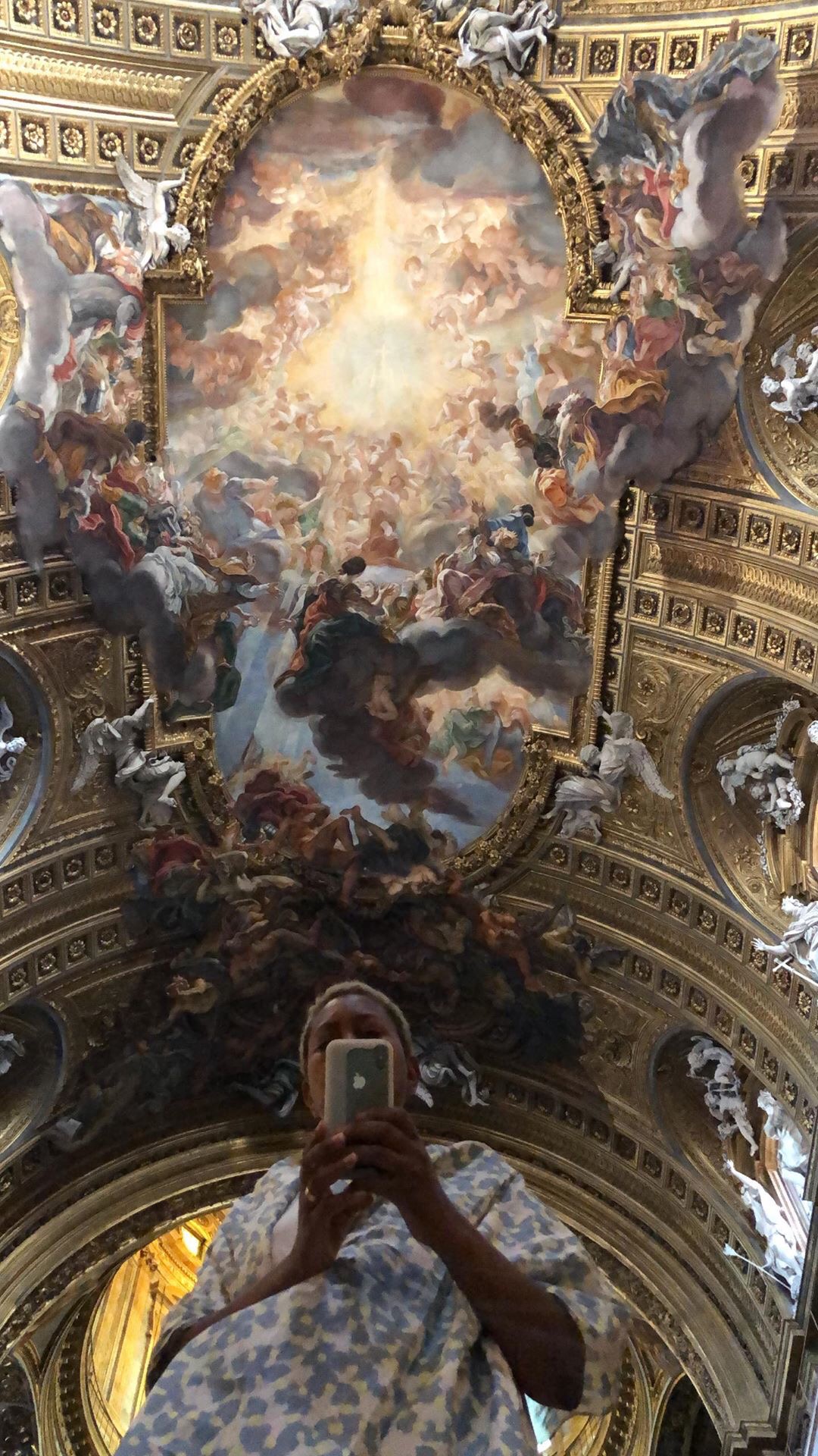 Phone raised in the Gesù in Rome, dwarfed by Baciccio's Triumph of the Name of Jesus boiling out of its gilded frame overhead