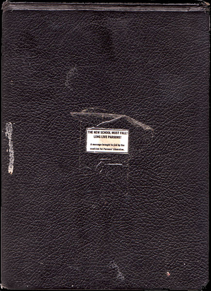 Cover of sketchbook 11, black leather-grain board with a small pasted label: 'THE NEW SCHOOL MUST FALL! LONG LIVE PARSONS!'