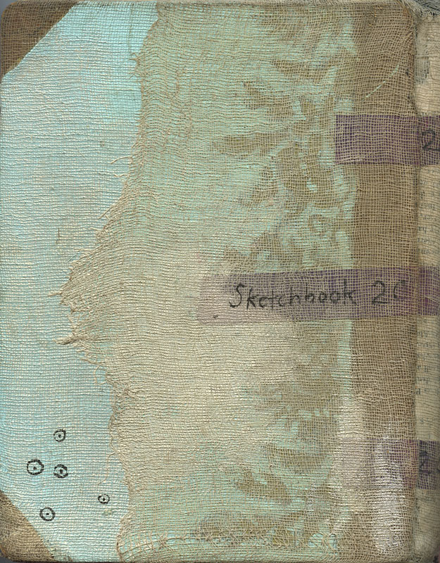 Back cover of sketchbook 20: layers of cheesecloth painted pale blue and gold over damask fabric, tiny eyelets inked lower left