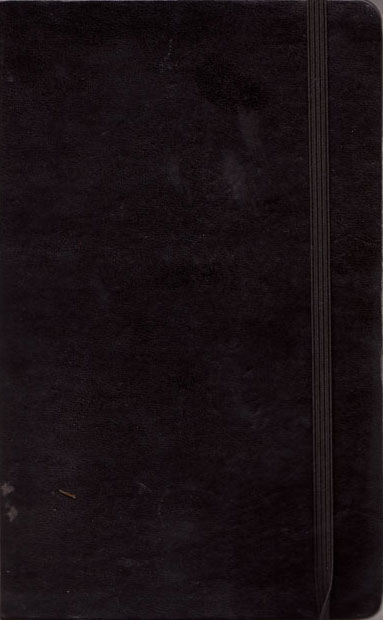 Cover of sketchbook 31: a plain black Moleskine with its elastic band, scuffed from travel Cover of sketchbook 31: a plain black Moleskine with its elastic band, scuffed from travel