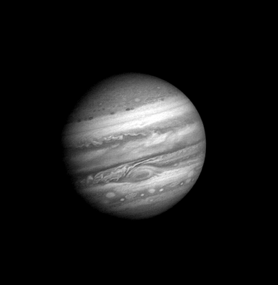 Voyager-style black-and-white photograph of Jupiter against black space, its banded clouds and Great Red Spot visible