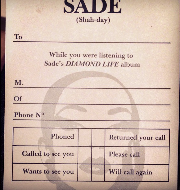 Novelty phone-message slip headed 'SADE (Shah-day)': 'While you were listening to Sade's DIAMOND LIFE album', with checkboxes like 'Phoned' and 'Wants to see you' over her faint portrait