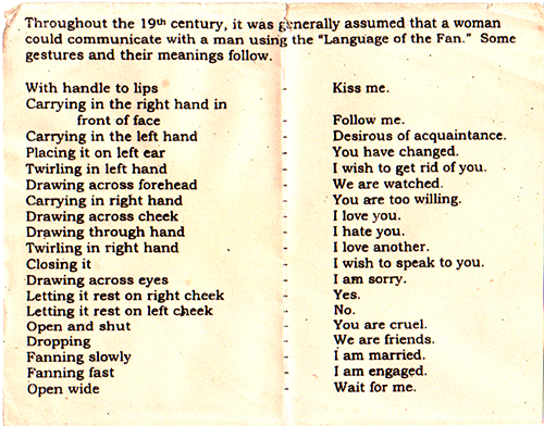 Printed card on the 19th-century 'Language of the Fan', pairing gestures with meanings — 'With handle to lips: Kiss me', 'Fanning fast: I am engaged', 'Open wide: Wait for me' Printed card on the 19th-century 'Language of the Fan', pairing gestures with meanings — 'With handle to lips: Kiss me', 'Fanning fast: I am engaged', 'Open wide: Wait for me'