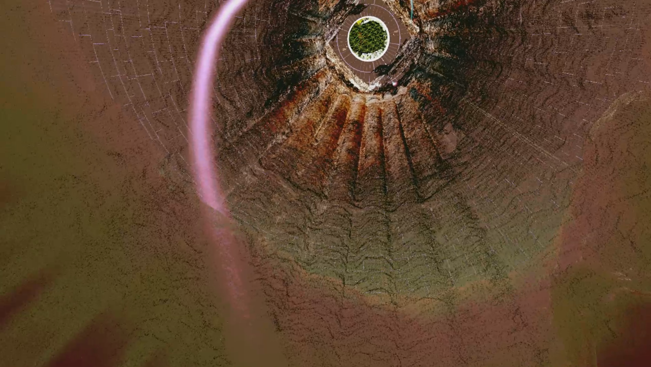 MinoRinth screenshot: looking down a vast fluted brown pit toward a small green labyrinth disc ringed in white at the bottom, a pink light-arc curving across MinoRinth screenshot: looking down a vast fluted brown pit toward a small green labyrinth disc ringed in white at the bottom, a pink light-arc curving across