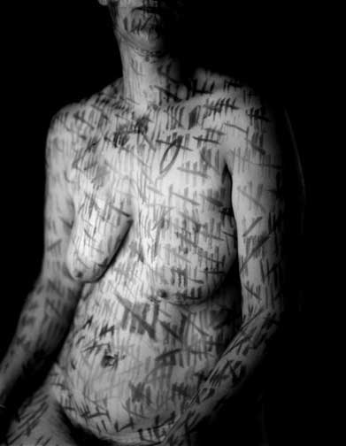 Susan Harbage Page's Palimpsest: black-and-white photograph of a nude torso covered in dark tally marks scored across the skin Susan Harbage Page's Palimpsest: black-and-white photograph of a nude torso covered in dark tally marks scored across the skin
