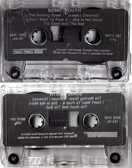 Both sides of Sonic Youth's first EP on SST cassette: clear shells listing The Burning Spear, I Dream I Dreamed, She Is Not Alone, The Good and the Bad