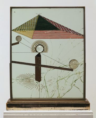 Duchamp's To Be Looked at (from the Other Side of the Glass) with One Eye, Close to, for Almost an Hour: a striped pyramid and lens on shattered glass