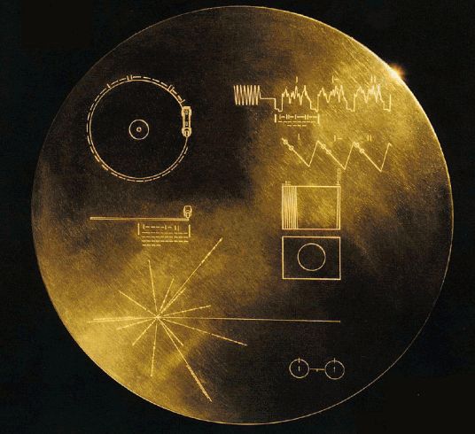 The Voyager Golden Record: etched playback instructions, a pulsar map, and the hydrogen atom diagram on the gold-plated disc