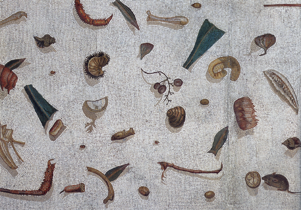 Detail of a Roman unswept-floor mosaic, the asaroton: fish bones, shells, fruit stems, claws, and a tiny mouse strewn across white tesserae