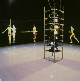 Teiji Furuhashi's Lovers: life-size nude figures projected walking and running around a dark room, a scaffold tower of projectors at its centre