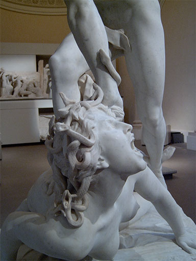 Marqueste's Perseus Slaying Medusa in marble, seen from below: the hero's arm grips the screaming gorgon by her snake-tangled hair